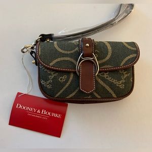 New with tags Dooney and Bourke dark green flap wristlet